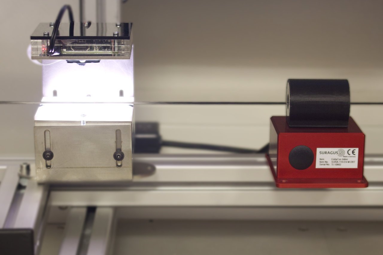 Combination of eddy current sensor and optical camera for fault detection of carbon fiber tow