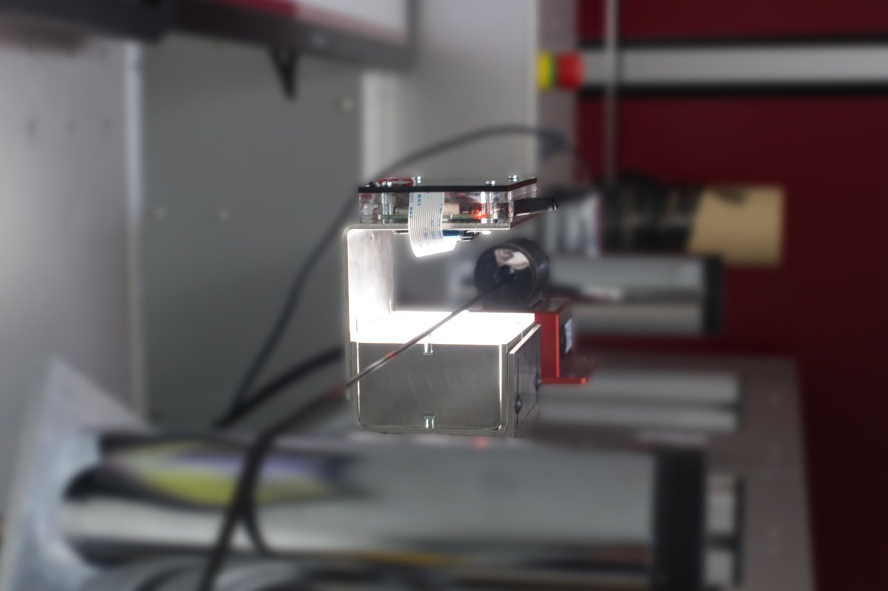 Combination of eddy current sensor and optical camera for fault detection of carbon fiber tow